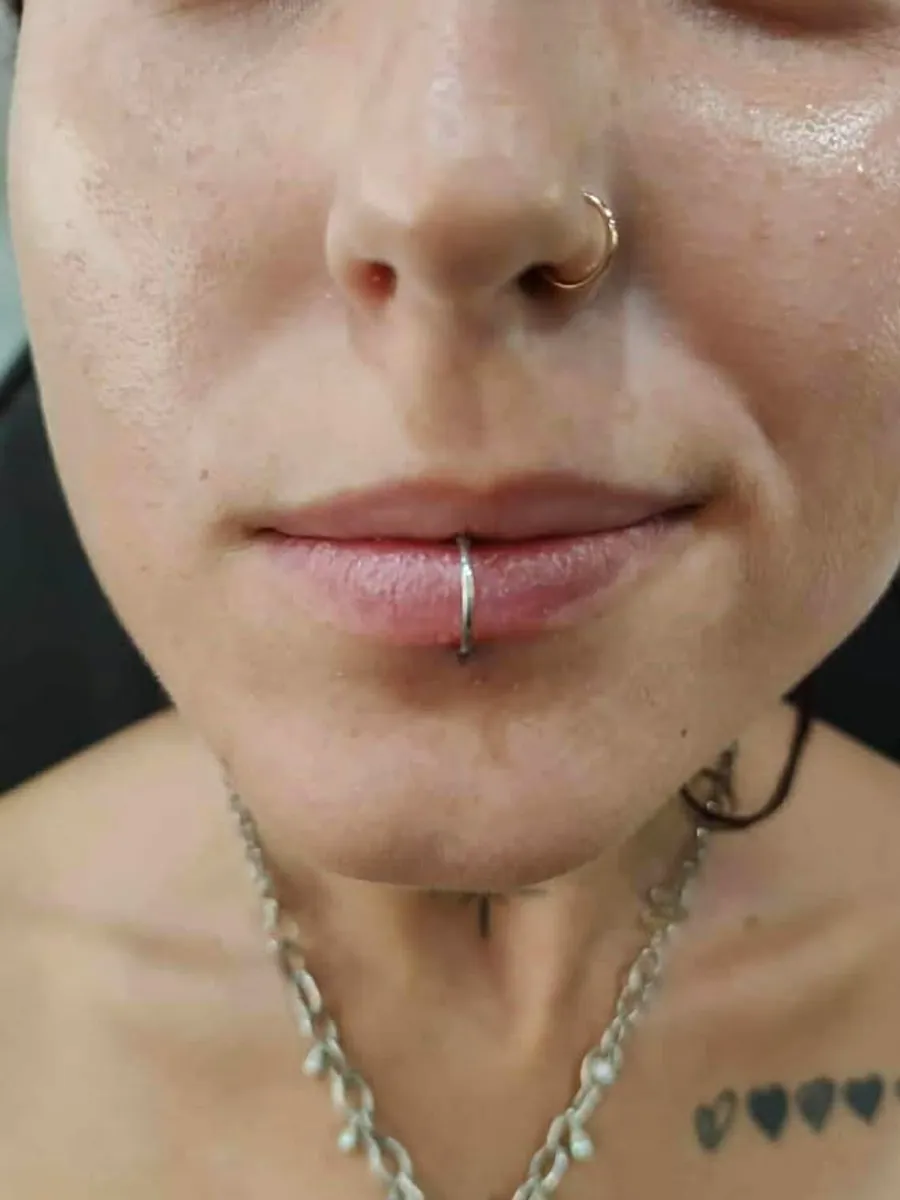 Lip and septum piercing by RUN INK Tattoo Bangkok