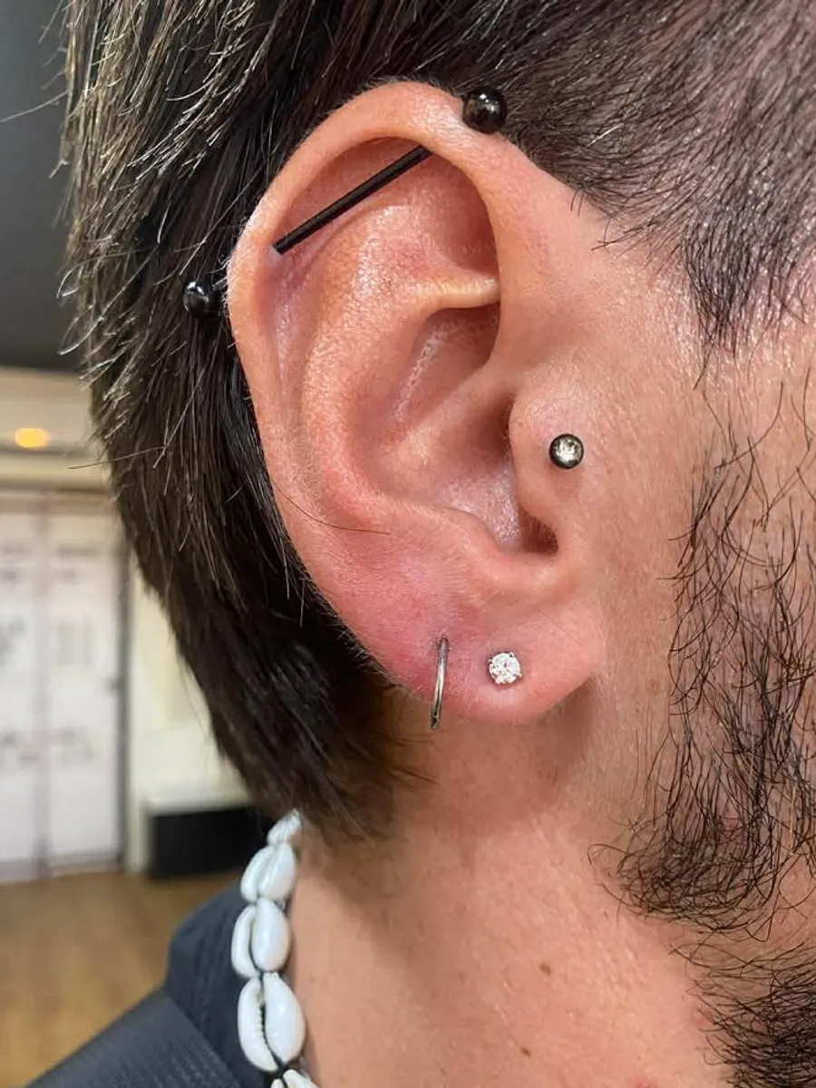Industrial ear piercing by RUN INK Tattoo Bangkok