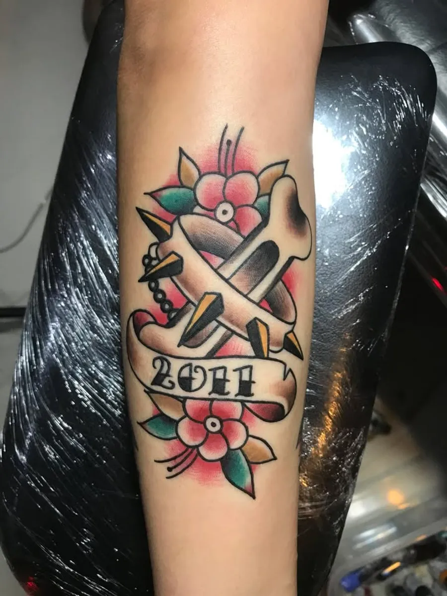 Color dagger and rose tattoo by RUN INK Tattoo Bangkok