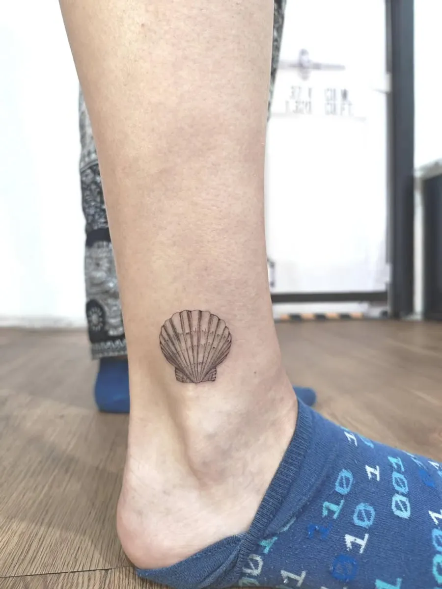 Fine Line seashell tattoo by RUN INK Tattoo Bangkok