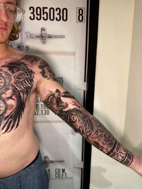 Black and Grey chest and full sleeve tattoo by RUN INK Tattoo Bangkok