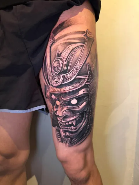 Black and Grey samurai mask tattoo by RUN INK Tattoo Bangkok