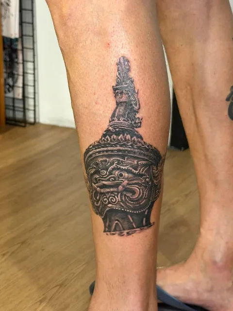Black and Grey Thai giant (Yaksha) calf tattoo by RUN INK Tattoo Bangkok
