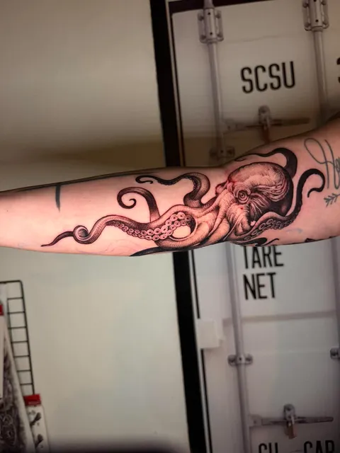 Color octopus forearm tattoo by RUN INK Tattoo Bangkok