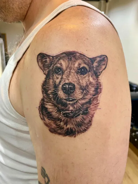 Realistic dog portrait shoulder tattoo by RUN INK Tattoo Bangkok